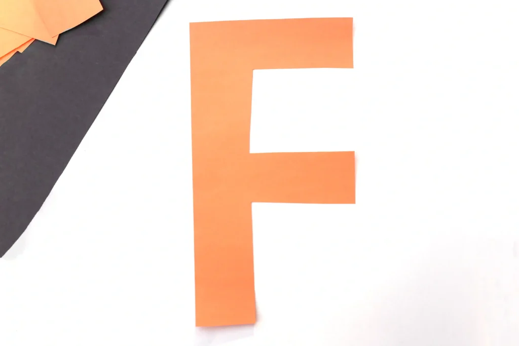 Letter F Fox Craft - Cultivating Brilliant Minds Orange paper cutout shaped like the letter F on a white background