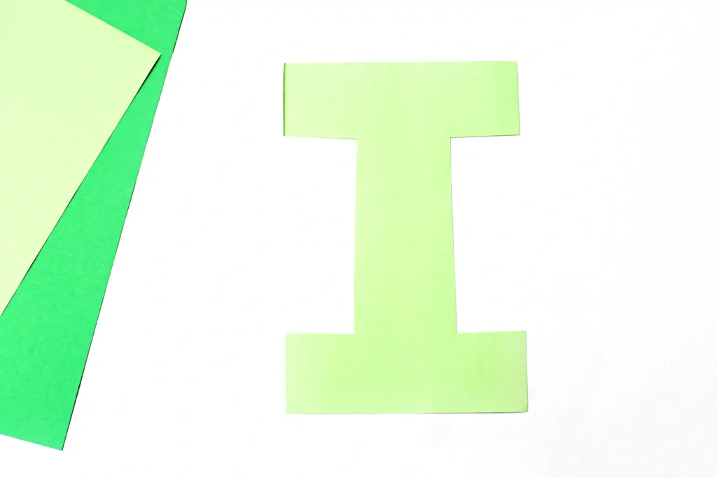 Letter I Iguana Craft - Cultivating Brilliant Minds Letter I cut out of green construction paper