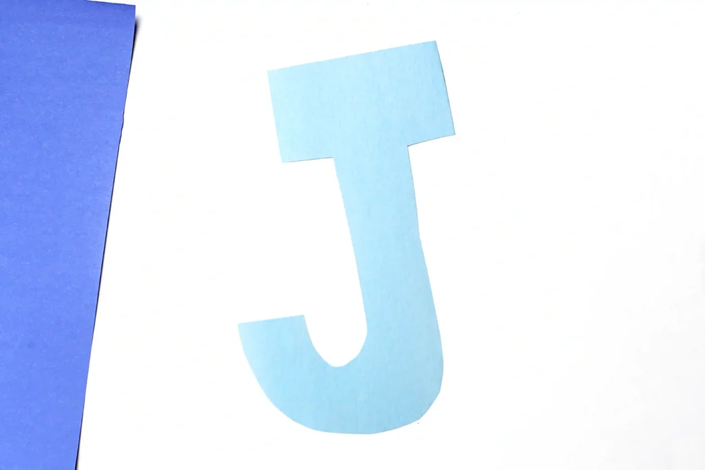 Letter J Jellyfish Craft - Cultivating Brilliant Minds letter j cut out of blue construction paper