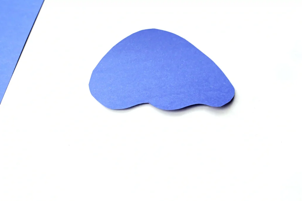 Letter J Jellyfish Craft - Cultivating Brilliant Minds Blue irregular blob shape on white background with a hint of left-edge blue strip nearby.