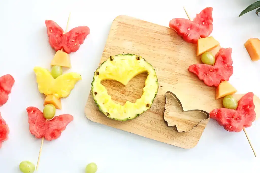 Spring Fruit Kabobs - Cultivating Brilliant Minds pineapple cut out in the shape of a butterfly