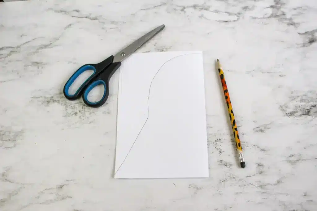 Darth Vader Hat - Cultivating Brilliant Minds a white piece of paper folded with an outline of a darth vader hat