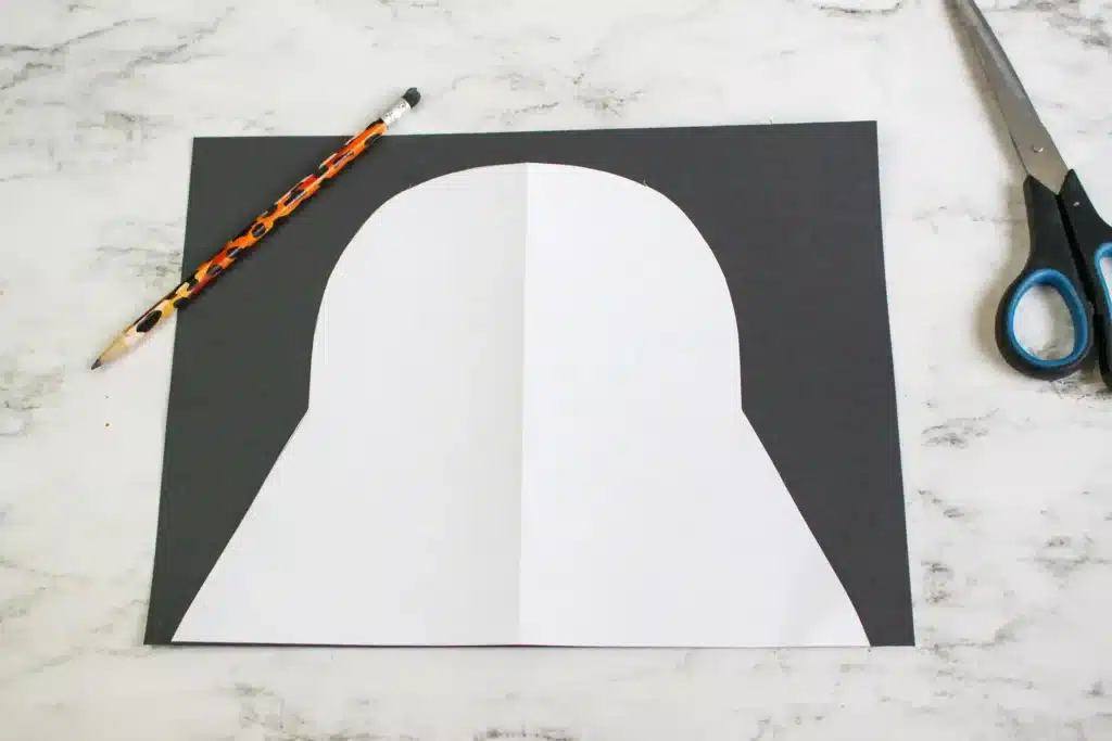 Darth Vader Hat - Cultivating Brilliant Minds a black piece of construction paper with a white piece of paper cut to look like darth vader's hat