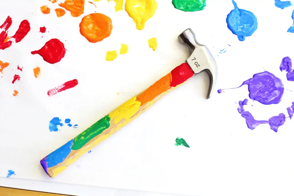 Hammer Father's Day Activity - Cultivating Brilliant Minds a hammer with the handle decorated with paint for a father's day craft