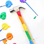 a hammer with the handle decorated with paint