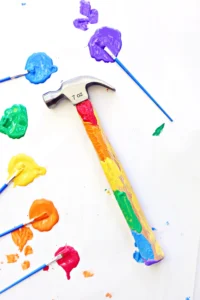 a hammer with the handle decorated with paint