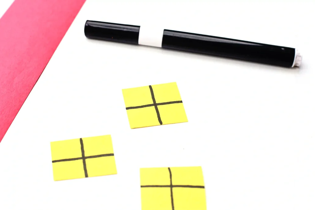 Letter H House Craft - Cultivating Brilliant Minds yellow rectangles of construction paper with black lines drawn on them to look like windowa