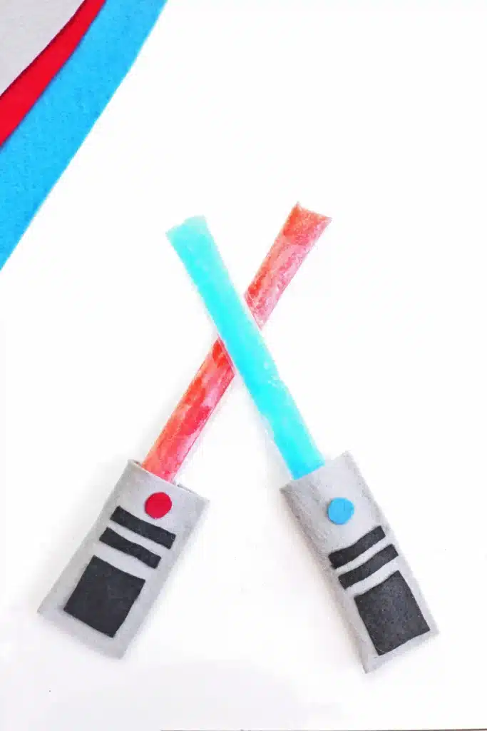 Felt Lightsaber Popsicle Holders - Cultivating Brilliant Minds a felt lightsaber popsicle holder that looks like a light saber