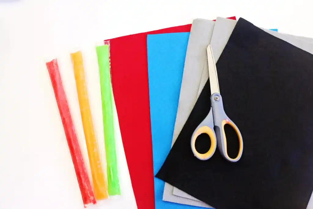 Felt Lightsaber Popsicle Holders - Cultivating Brilliant Minds supplies for the star wars craft - felt, popsicles, and scissors