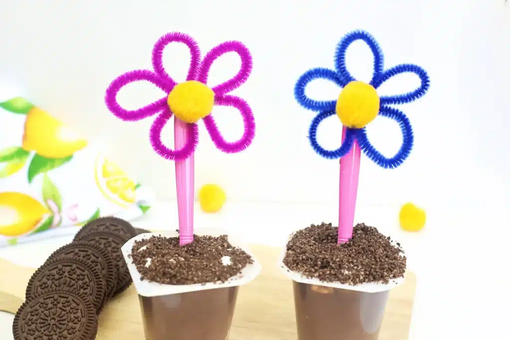 Flower Pot Parfait Cups - Cultivating Brilliant Minds flower pot parfait cups with marshmallows, crushed oreos, and a flower spoon