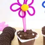 Flower Pot Parfait Cups - Cultivating Brilliant Minds flower pot parfait cups with marshmallows, crushed oreos, and a flower spoon