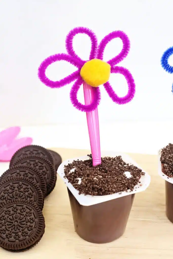 Flower Pot Parfait Cups - Cultivating Brilliant Minds flower pot parfait cups with marshmallows, crushed oreos, and a flower spoon