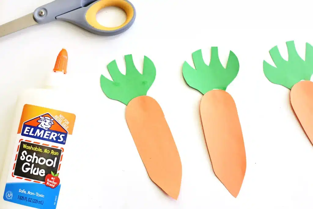 Carrot Garden Paper Plate Craft - Cultivating Brilliant Minds carrots made out of orange and green construction paper