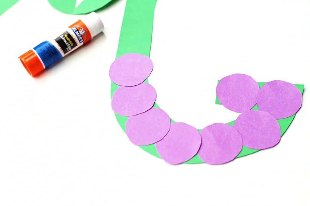 Letter G Grape Craft - Cultivating Brilliant Minds letter g grape craft of a green g with purple circles glued on top