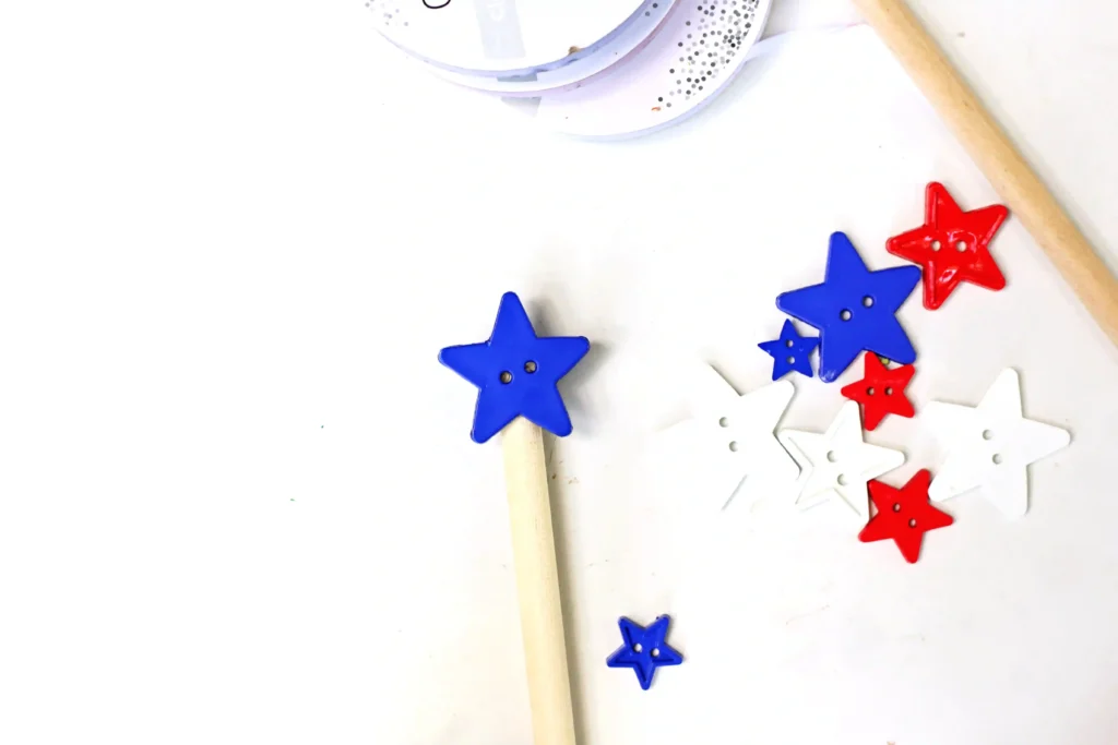 American Flag Wands - Cultivating Brilliant Minds a blue star button glued on to a dowel