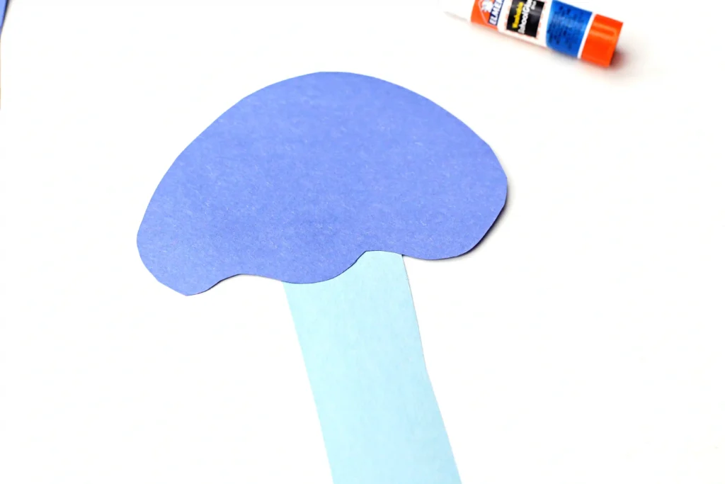Letter J Jellyfish Craft - Cultivating Brilliant Minds blue construction paper cut to look like a jellyfish