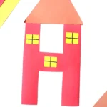 a letter h cut out of construction paper and decorated to look like a house