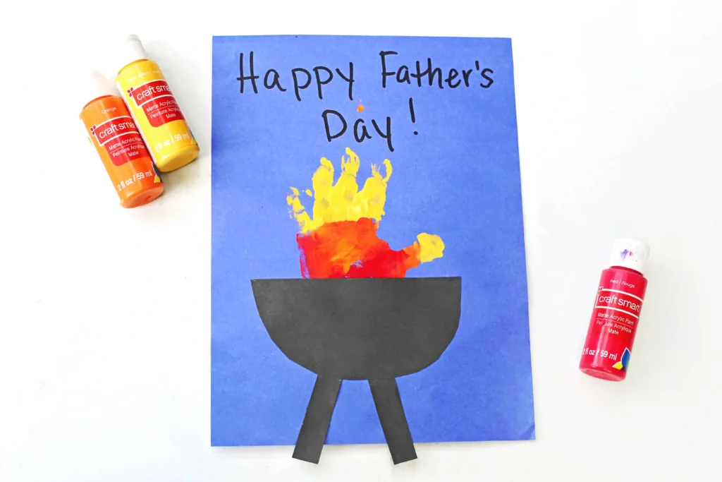 Father's Day Handprint Craft - Cultivating Brilliant Minds a yellow, orange, and red handprint with a construction paper grill on blue paper that reads" happy father's day!"