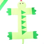 a letter i craft of an iguana made out of green construction paper