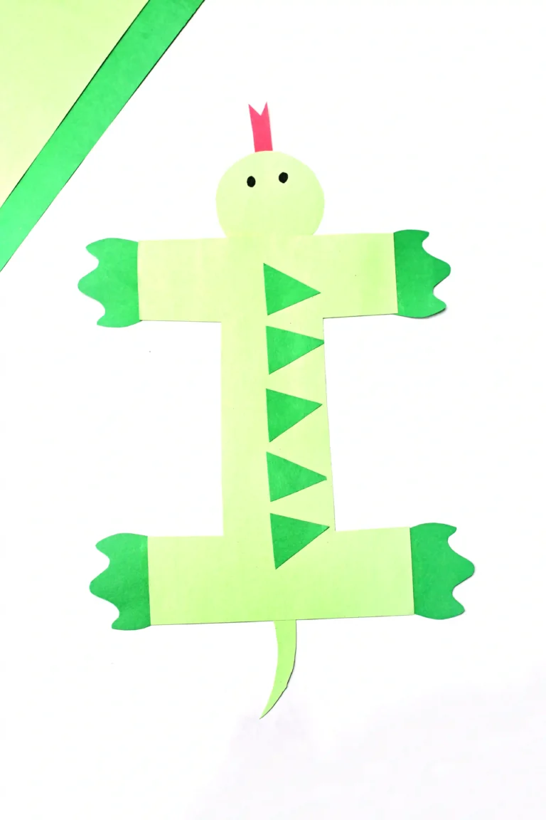 a letter i craft of an iguana made out of green construction paper