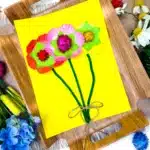 Cupcake Liner Flower Craft - Cultivating Brilliant Minds a cupcake liner flower craft that uses cupcake liners and pom poms as the flowers and pipe cleaners for the stems