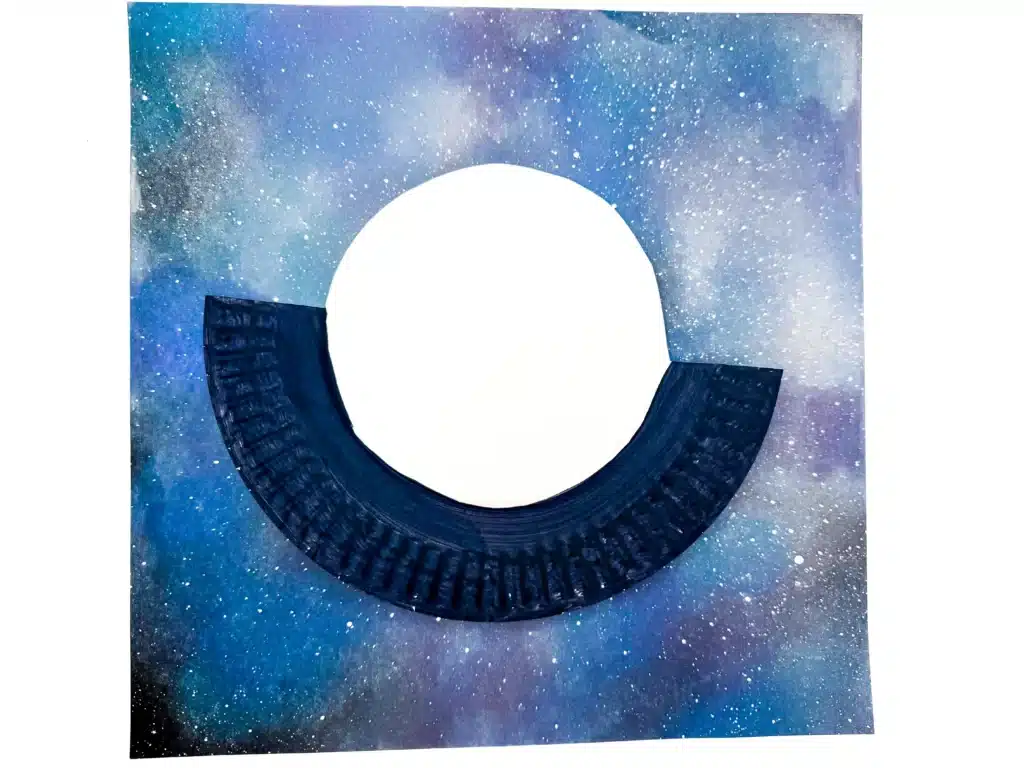 UFO Paper Plate Craft - Cultivating Brilliant Minds a ufo craft made from a paper plate that is painted black
