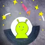 UFO Paper Plate Craft - Cultivating Brilliant Minds a paper plate cut and painted to look like a UFO with an alien inside