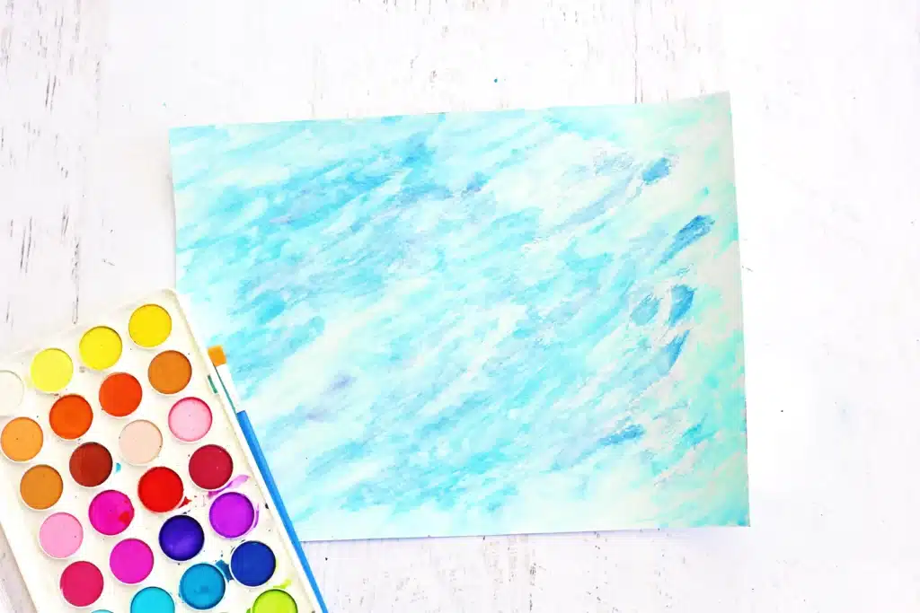 Coral Blow Painting With Straws - Cultivating Brilliant Minds watercolor paper painted to look like the ocean