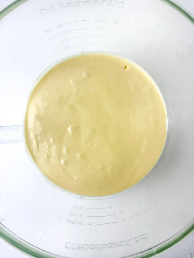 Pineapple Cupcakes - Cultivating Brilliant Minds vanilla pineapple cake batter in a glass bowl