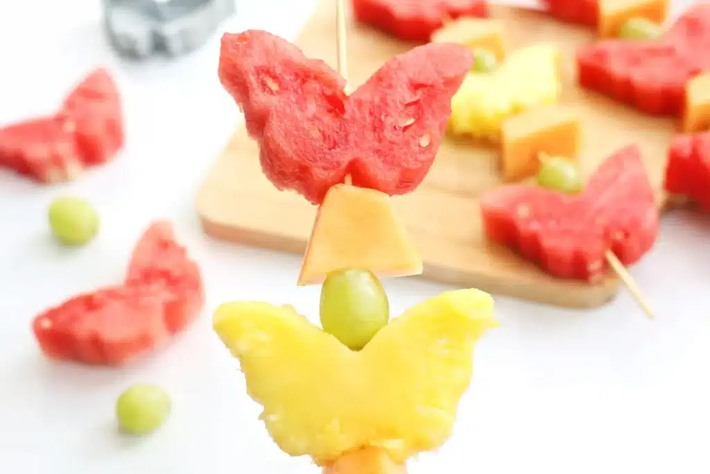 Spring Fruit Kabobs - Cultivating Brilliant Minds watermelon, pineapple, grapes, and cantaloupe on a skewer