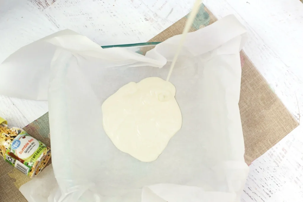 Bumble Bee Bark - Cultivating Brilliant Minds White melted chocolate on parchment paper