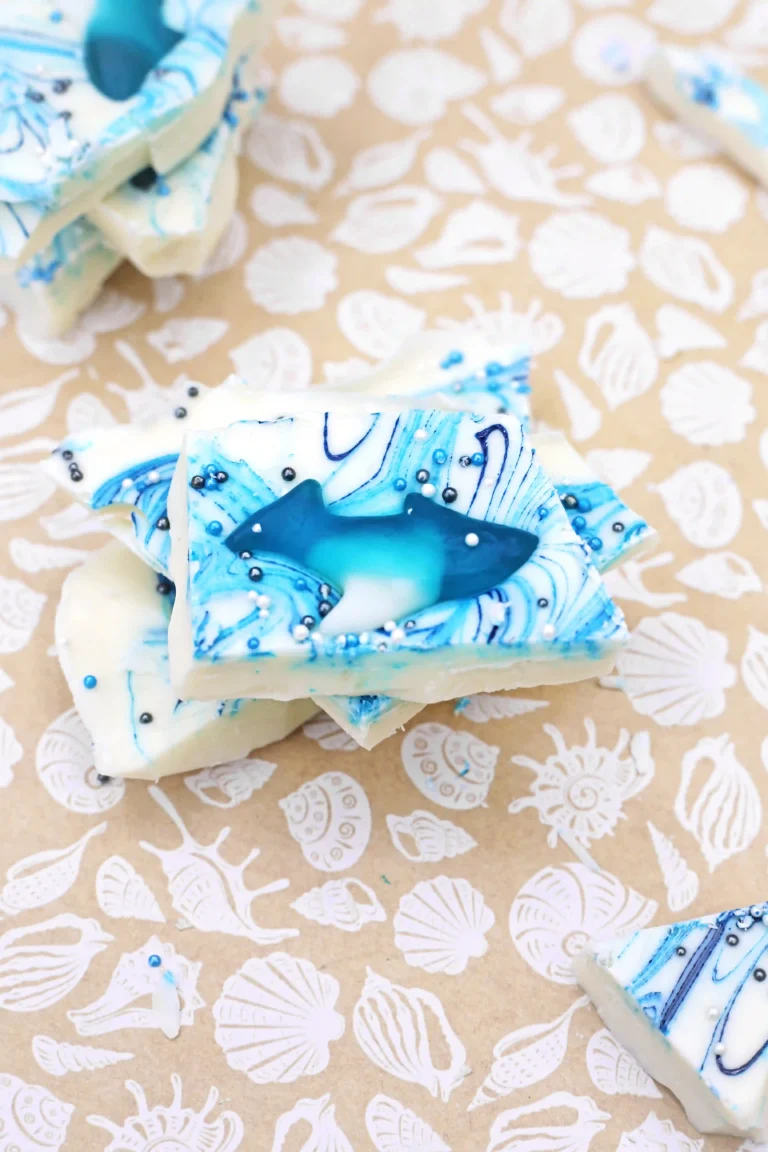white chocolate bark with gummy sharks and sprinkles