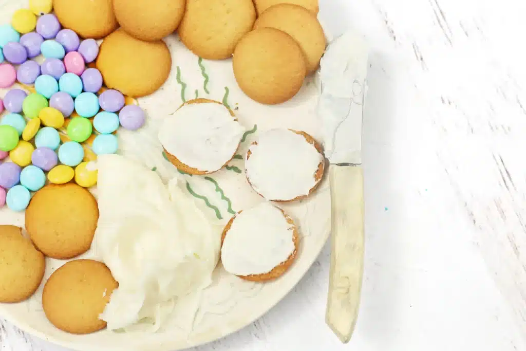 Vanilla Wafer Flower Cookies - Cultivating Brilliant Minds vanilla icing on a wafer cookie