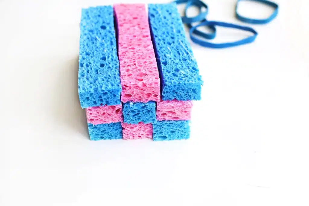 DIY Sponge Toss - Cultivating Brilliant Minds Stack of blue and pink kitchen sponges