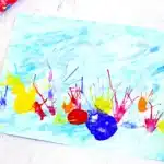 Coral Blow Painting With Straws - Cultivating Brilliant Minds a coral blow painting with straws that has a watercolor background and coral made by blowing paint through a straw