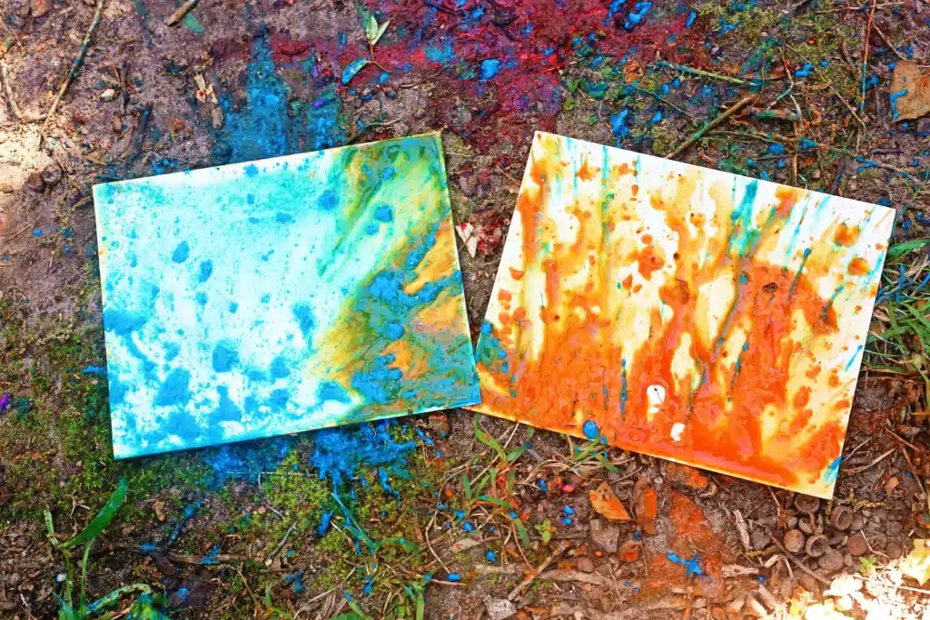 Water Balloon Splatter Art - Cultivating Brilliant Minds water balloon splatter art of a canvas with paint splatters on it
