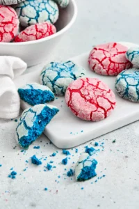 red and blue crinkle cookies on a white board