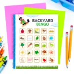a bingo card that has backyard nature items on it, like a ladybug and a rock.