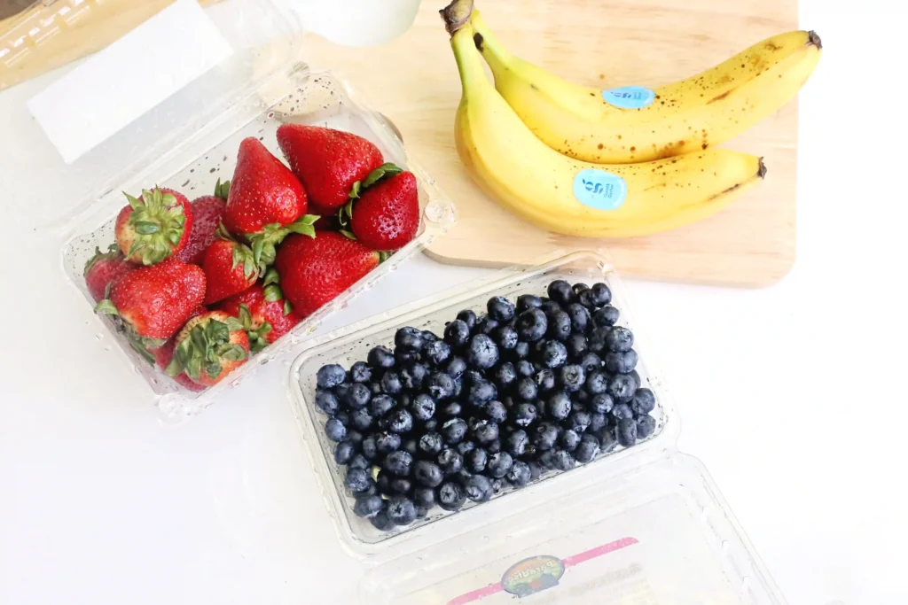 ingredients for this patriotic charcuterie board- strawberries, bananas, and blueberries