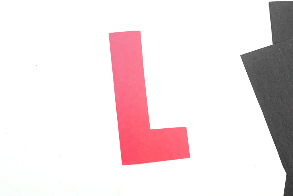 red construction paper cut in to the letter l