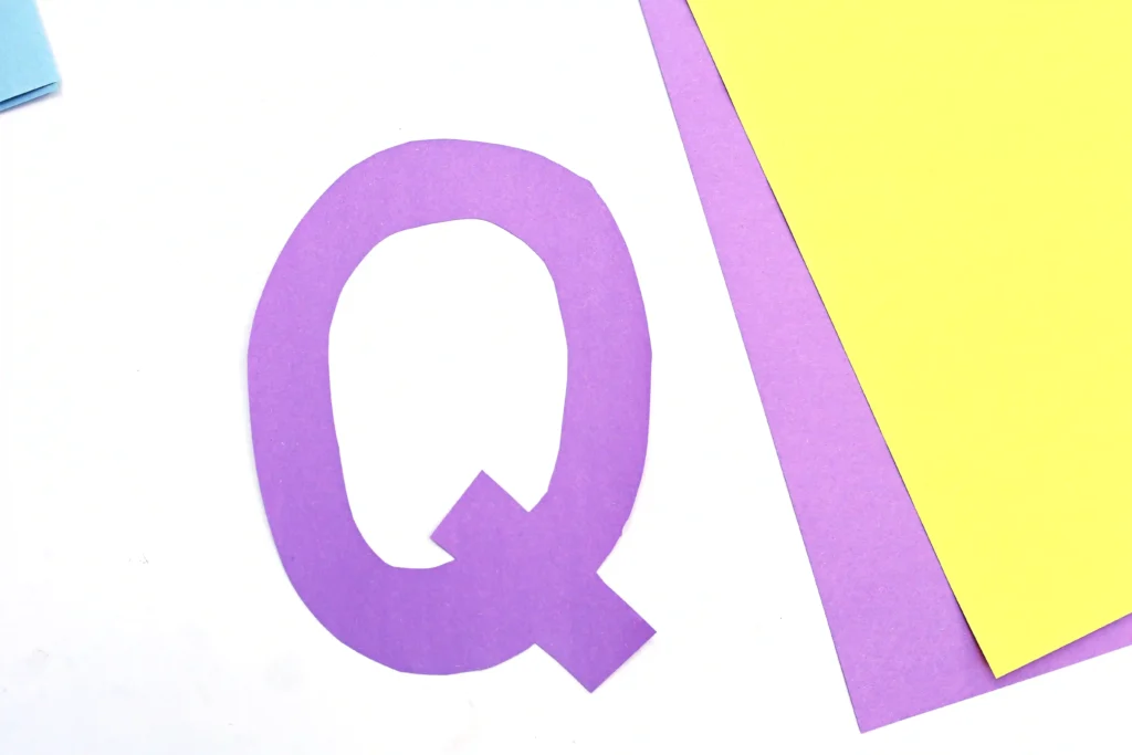 Letter Q Queen Craft - Cultivating Brilliant Minds the letter Q cut out of purple construction paper