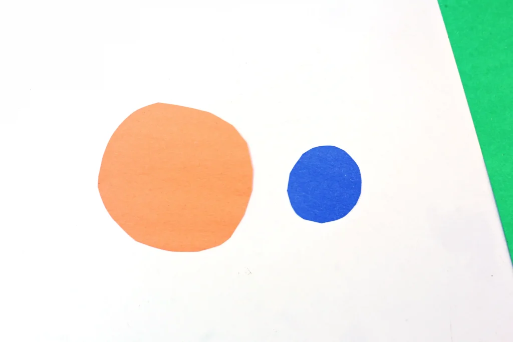 orange and blue circles cut out of construction paper
