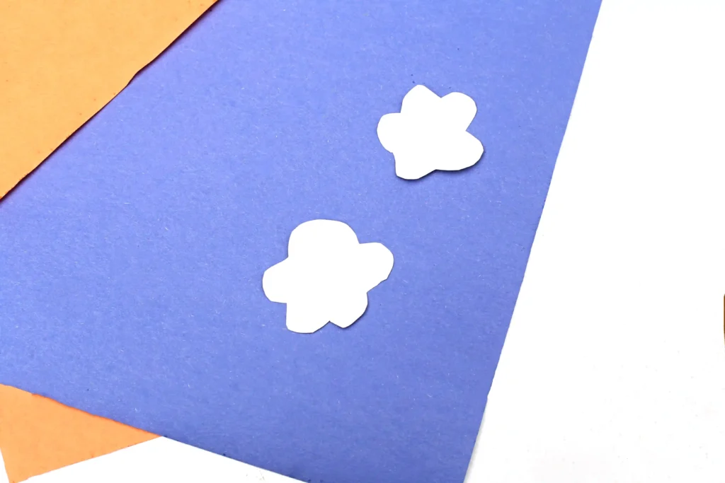 clouds cut out of white construction paper