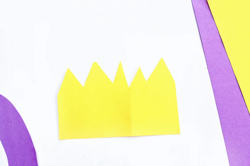 Letter Q Queen Craft - Cultivating Brilliant Minds a crown cut out of yellow construction paper