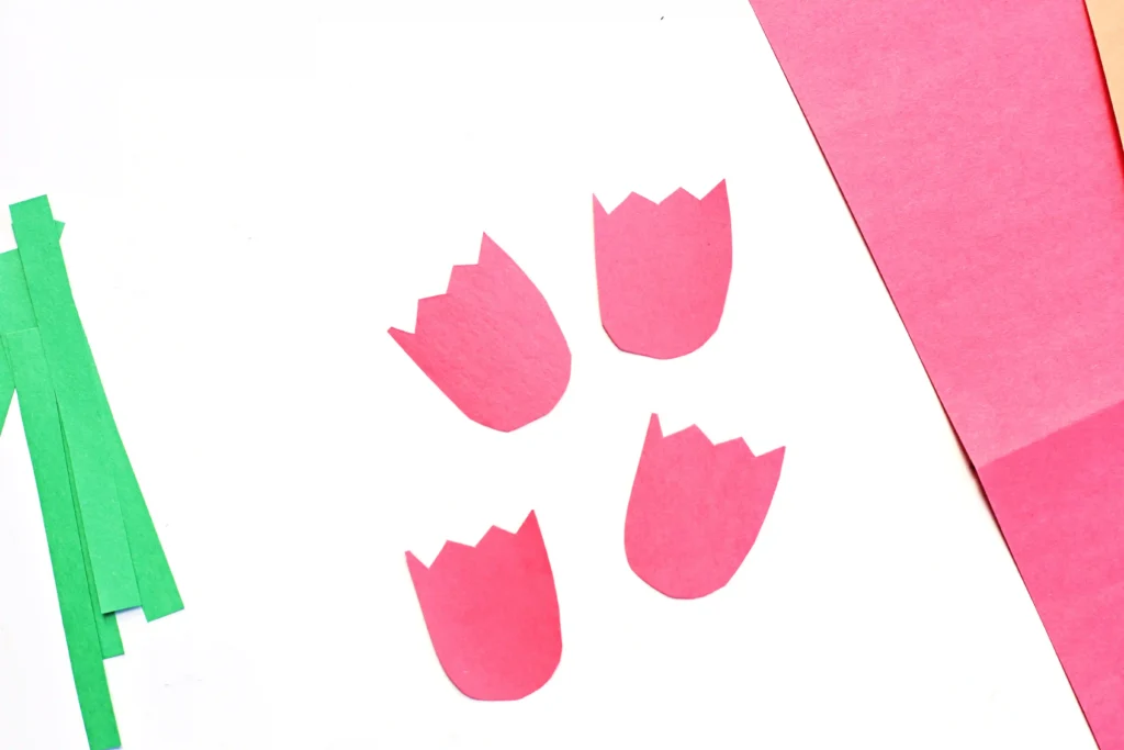 red construction paper cut into flower shapes for this letter craft for preschoolers