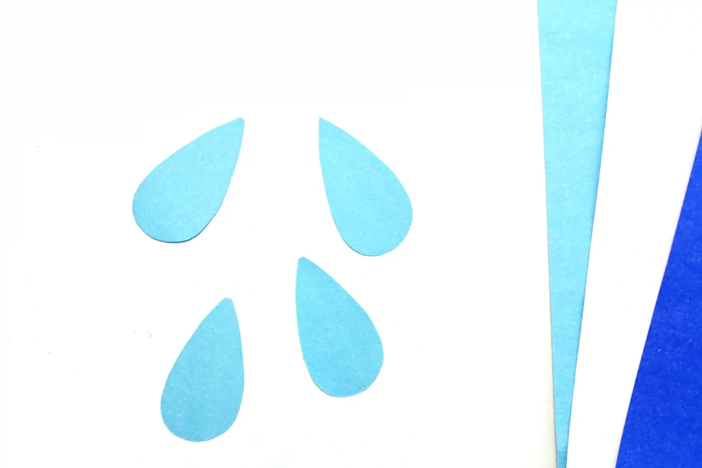 raindrops cut out of light blue construction paper for this letter craft for preschoolers