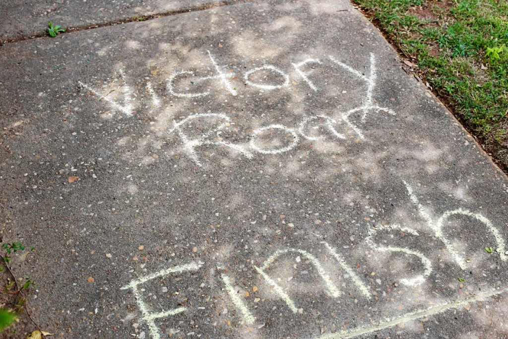 Chalk-drawn game layout on a concrete sidewalk,