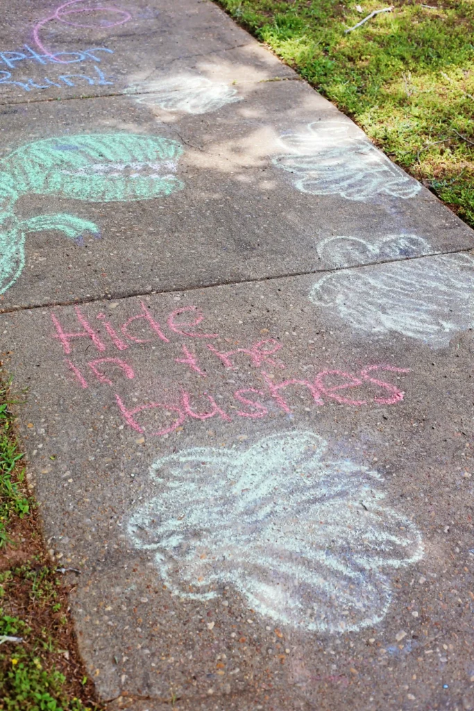 a dinosaur sidewalk chalk obstacle course for kids