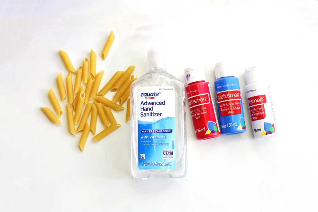 Patriotic Pasta Necklaces - Cultivating Brilliant Minds supplies for the Patriotic Pasta Necklaces: penne pasta, hand sanitizer, and red white and blue paint