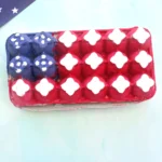 a patriotic craft that uses an egg carton and paints it to look like the american flag to create a fourth of july recycled craft